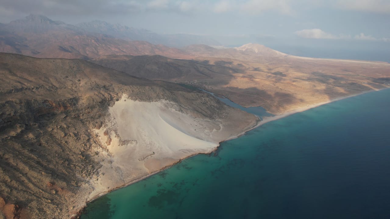 Aerial view of Socotra's dune-and-mountain coastline